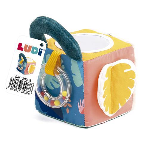 Cubo sensorial LUDI com pega azul, espelho, anel transparente com contas coloridas e folha amarela em tecido.